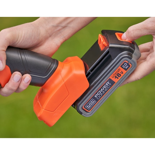 BLACK+DECKER BCSS18D1 lithium 18V Power Connect battery being attached to an orange and black tool handle.