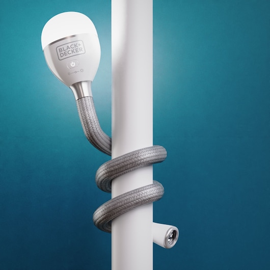 Photo of BLACK+DECKER BDCFSL01 flexible LED lamp wrapped around a white pole on a blue background.