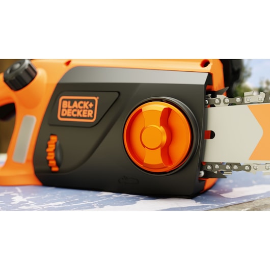 BLACK+DECKER BECS1835 chainsaw close-up showing orange adjustment dial and blade.