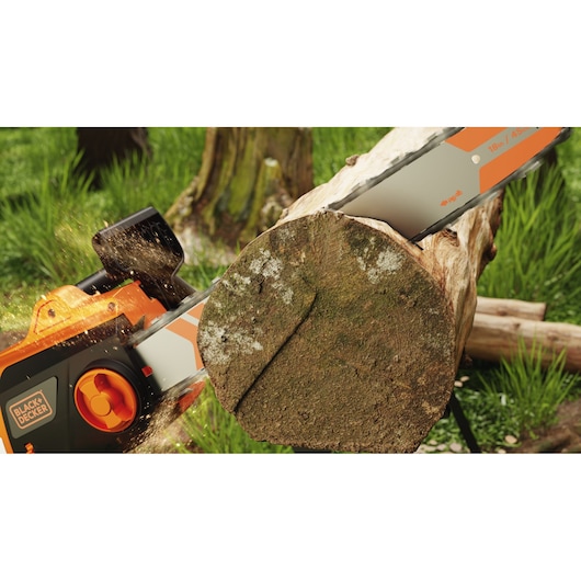 Photo of BLACK+DECKER BECS2245 chainsaw cutting through a large log outdoors, showing sawdust flying.