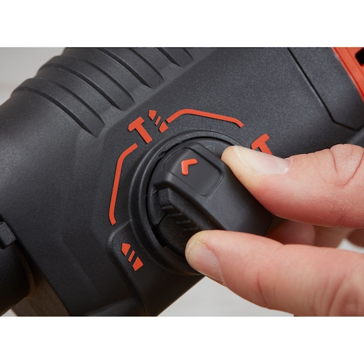 BLACKDECKER BEHS01K hammer drill mode selector close-up with red markings, hand adjusting dial.