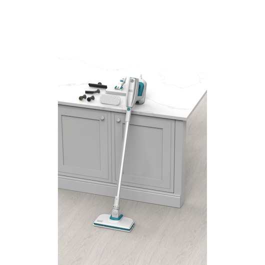 BLACKDECKER BHSM15FX10 steam mop with white and teal body, multiple cleaning attachments, shown from front angle.