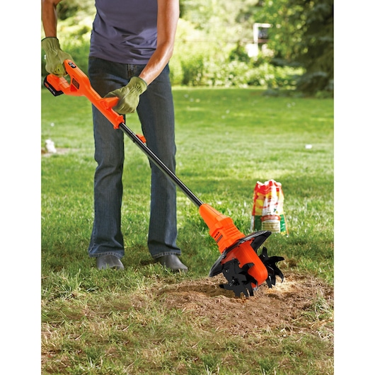 BLACK+DECKER 18V tiller in use