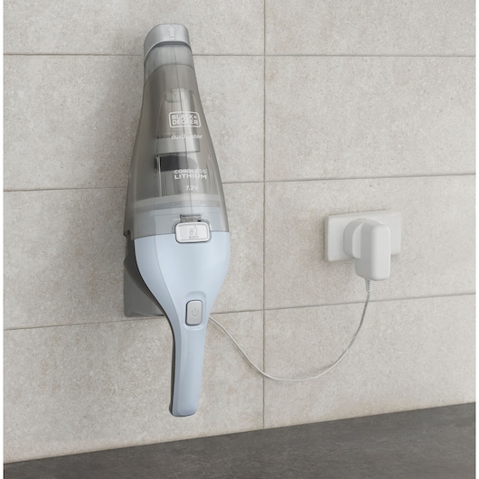 BLACKDECKER NVC215W handheld vacuum cleaner wall mounted and charging, gray and white finish.